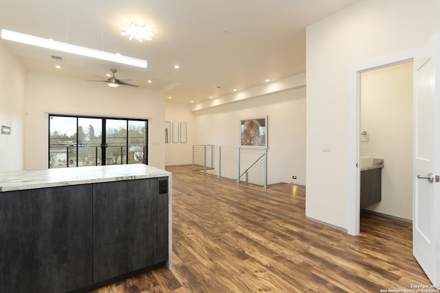 kitchen featuring ceiling fan and dark hardwood / wood-style flooring