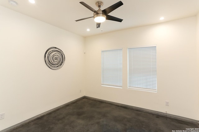 spare room with ceiling fan