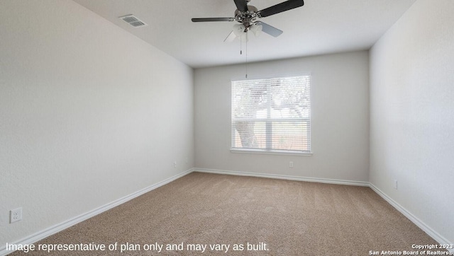 spare room with ceiling fan and carpet flooring