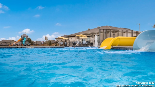 view of pool featuring a water slide