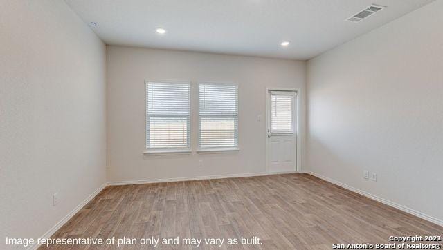 unfurnished room featuring light wood-type flooring