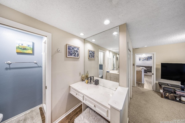 bathroom featuring vanity and a textured ceiling