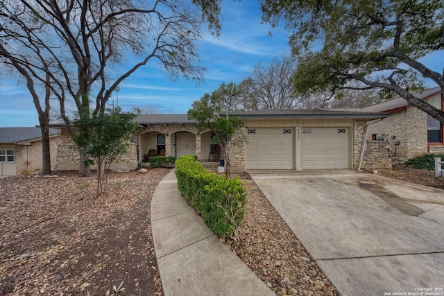 ranch-style house featuring a garage