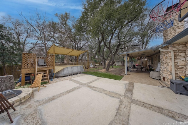 view of patio with a playground