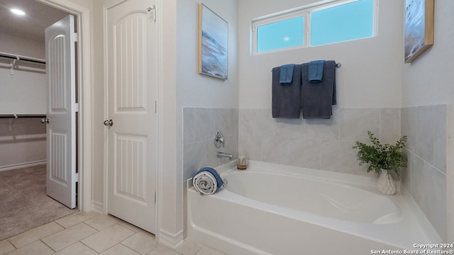 bathroom featuring a bathtub and tile patterned floors