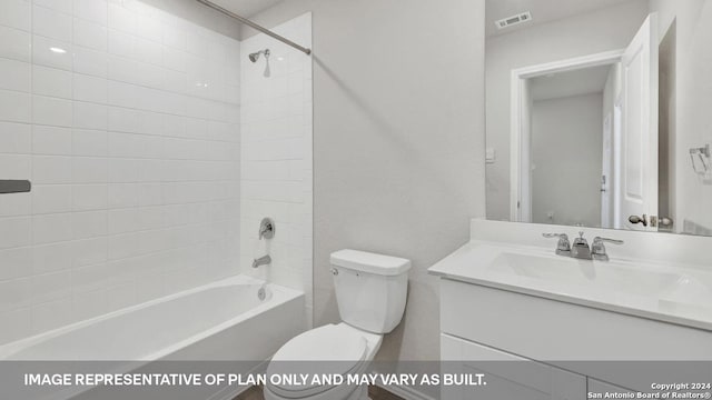 full bathroom with tiled shower / bath, vanity, and toilet