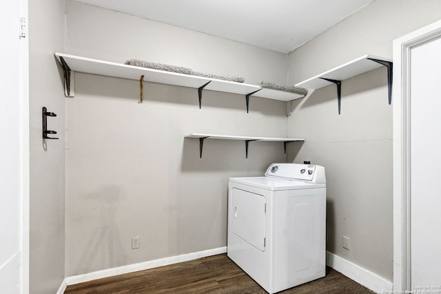 washroom with washer / dryer and dark hardwood / wood-style flooring