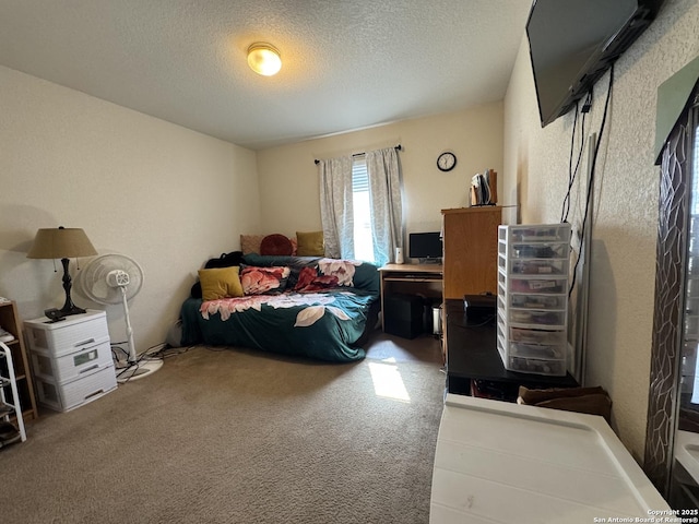 carpeted bedroom with a textured ceiling