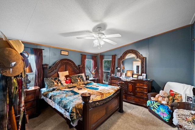 bedroom featuring light carpet, ceiling fan, ornamental molding, and a textured ceiling