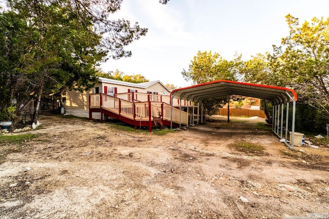 view of parking / parking lot featuring a carport