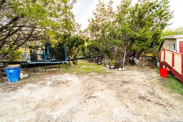 view of yard featuring a trampoline