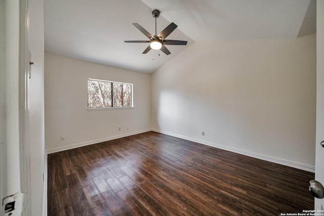 unfurnished room featuring lofted ceiling, dark wood-type flooring, and ceiling fan