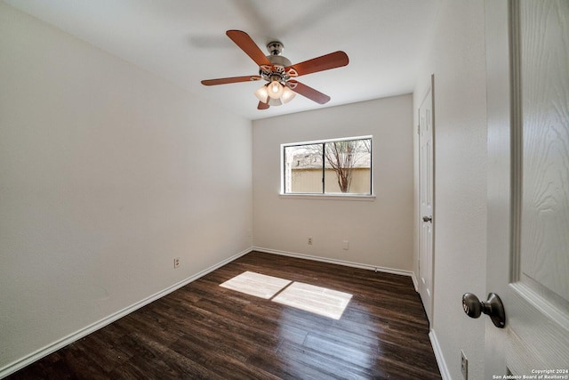 empty room featuring dark hardwood / wood-style floors and ceiling fan