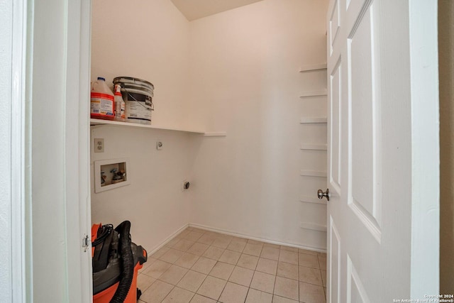 washroom featuring hookup for a washing machine, hookup for an electric dryer, and light tile patterned flooring