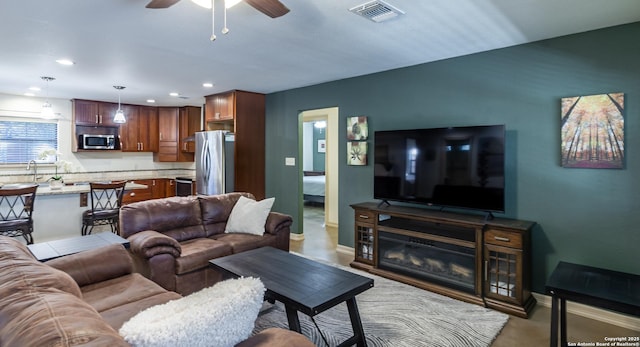 living room featuring ceiling fan