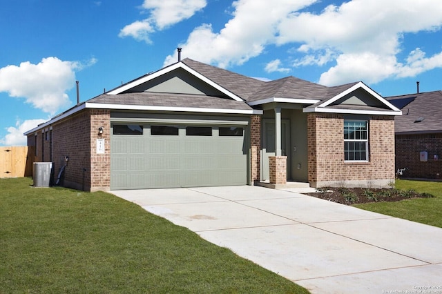 view of front of property with a garage and a front lawn