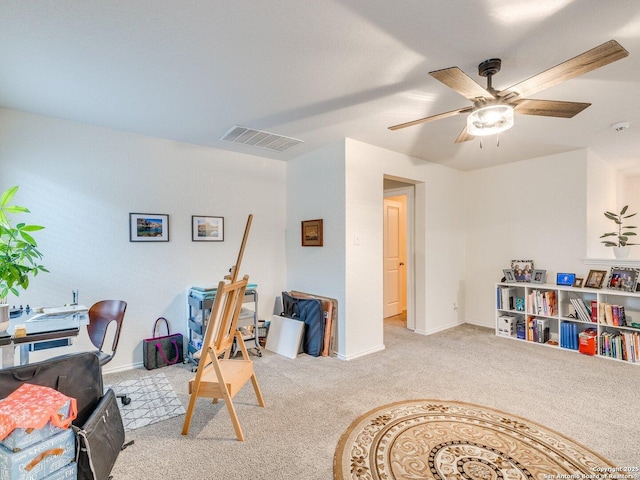 interior space with ceiling fan