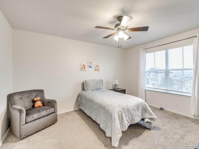 carpeted bedroom featuring ceiling fan