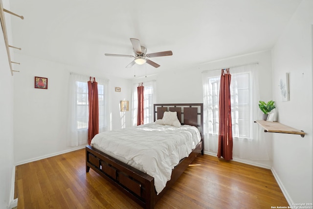 bedroom featuring hardwood / wood-style floors and ceiling fan