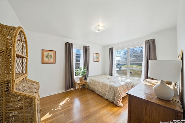 bedroom with light hardwood / wood-style floors