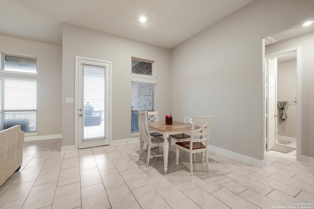 dining space featuring light tile patterned floors