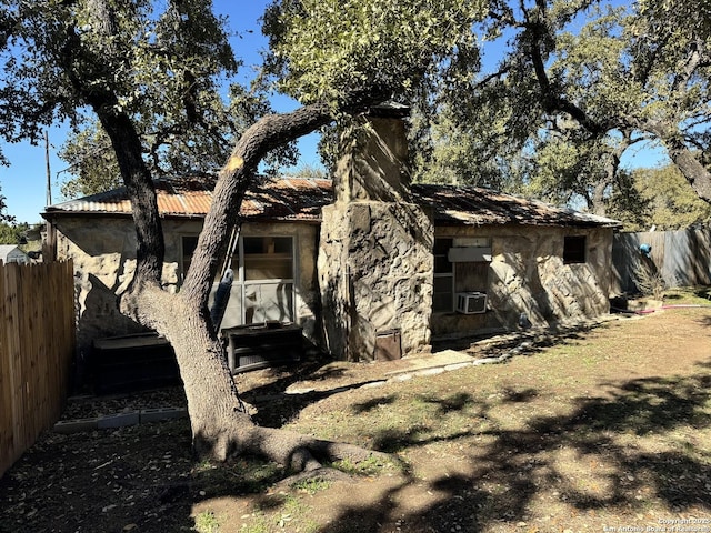 view of side of home with cooling unit