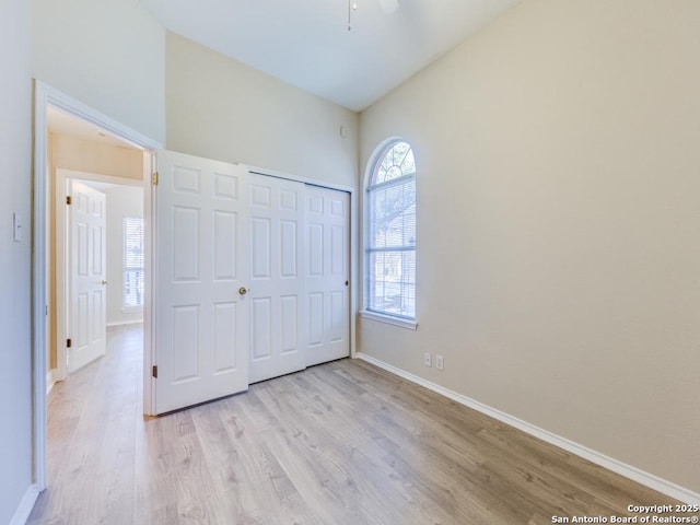 unfurnished bedroom featuring a closet and light wood-type flooring