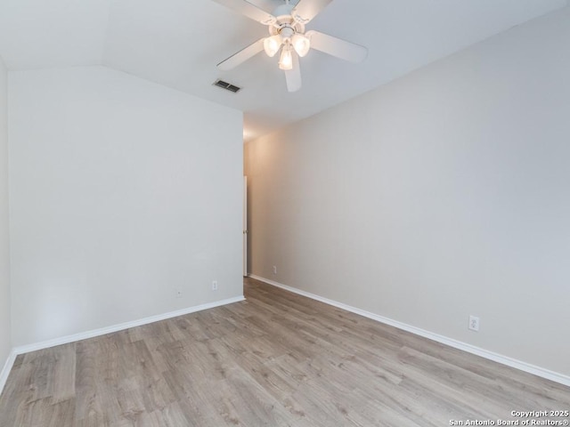 spare room with light hardwood / wood-style flooring and ceiling fan