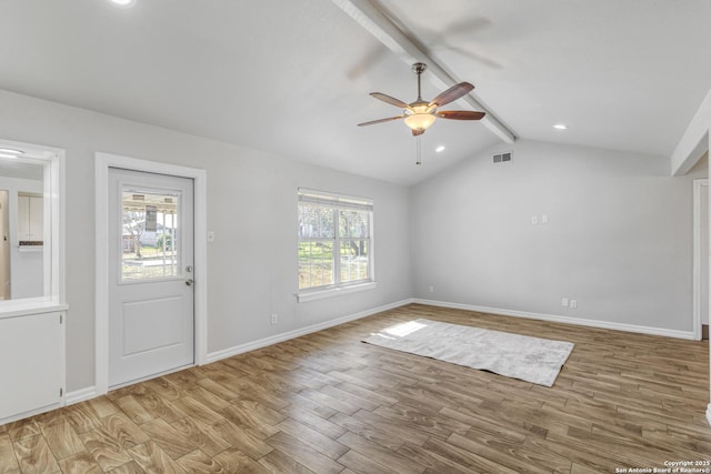 entrance foyer with lofted ceiling with beams, ceiling fan, and light wood-type flooring