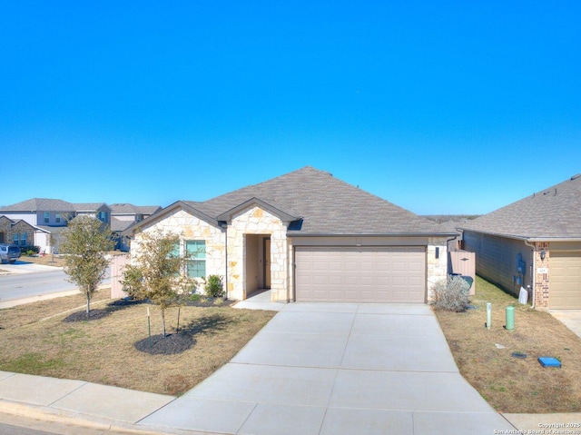 ranch-style home featuring a garage