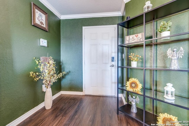 foyer entrance featuring ornamental molding and dark hardwood / wood-style floors