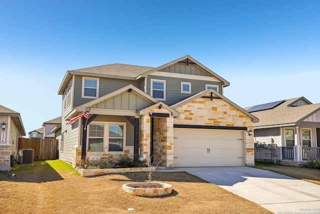 craftsman-style home with a garage and cooling unit