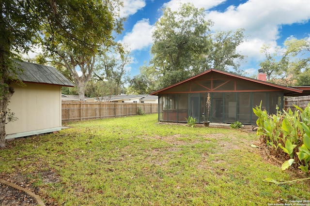 view of yard featuring a sunroom