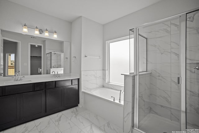 10257 Bartenheim Dr, Schertz, TX 78154 - full bathroom featuring marble finish floors, a stall shower, a bath, and double vanity