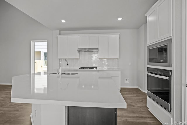 10257 Bartenheim Dr, Schertz, TX 78154 - kitchen featuring wall oven, a sink, under cabinet range hood, built in microwave, and black cooktop