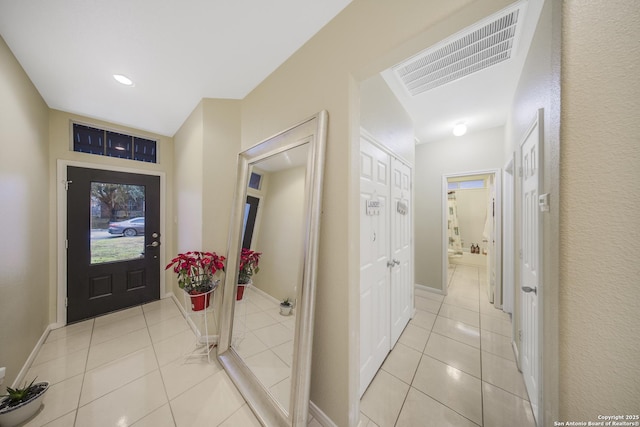 entryway featuring light tile patterned floors