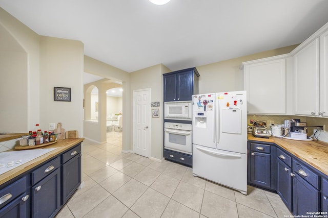 kitchen featuring white cabinetry, white appliances, wood counters, and blue cabinetry