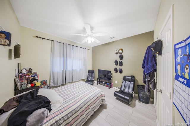 bedroom featuring ceiling fan and light hardwood / wood-style flooring