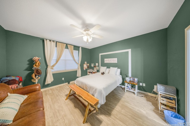 bedroom featuring hardwood / wood-style flooring and ceiling fan