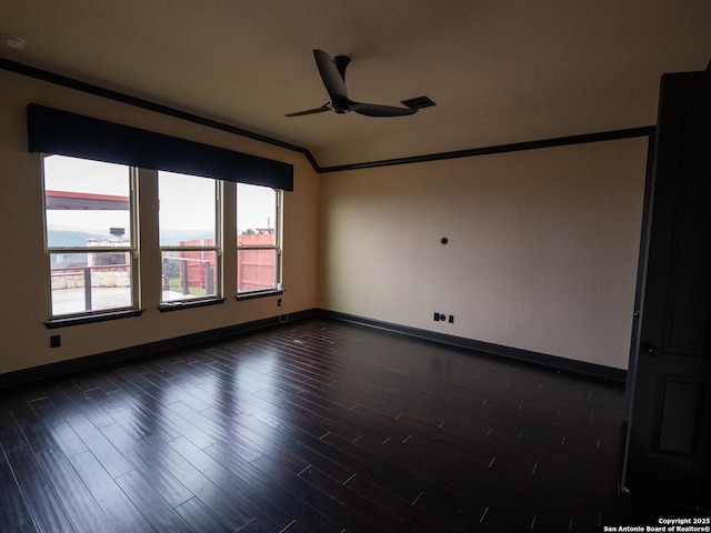 spare room featuring ornamental molding, dark hardwood / wood-style floors, and ceiling fan