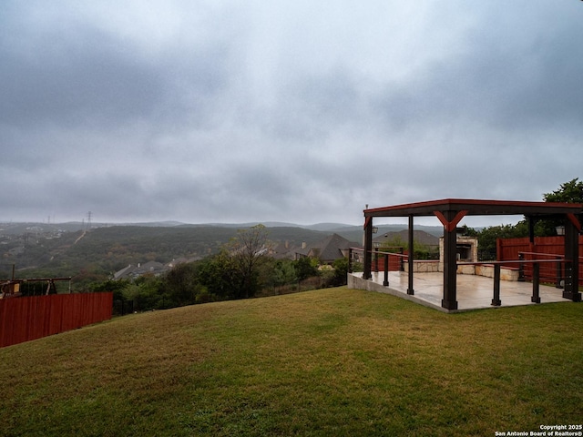 view of yard with a mountain view and a patio