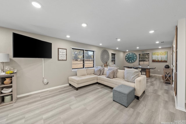 living room with light hardwood / wood-style flooring