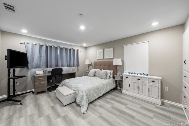 bedroom with light hardwood / wood-style floors