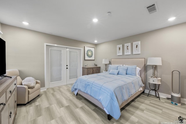 bedroom with access to outside, light hardwood / wood-style floors, and french doors