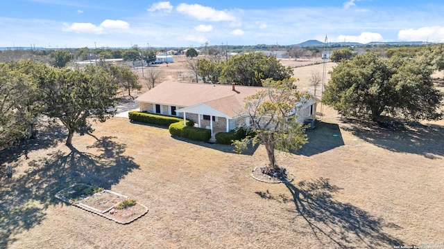 birds eye view of property featuring a mountain view