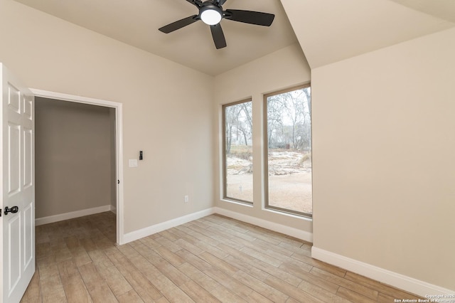 unfurnished room featuring ceiling fan and light hardwood / wood-style flooring