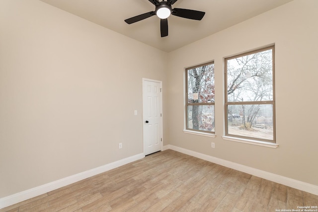 empty room featuring ceiling fan and light wood-type flooring