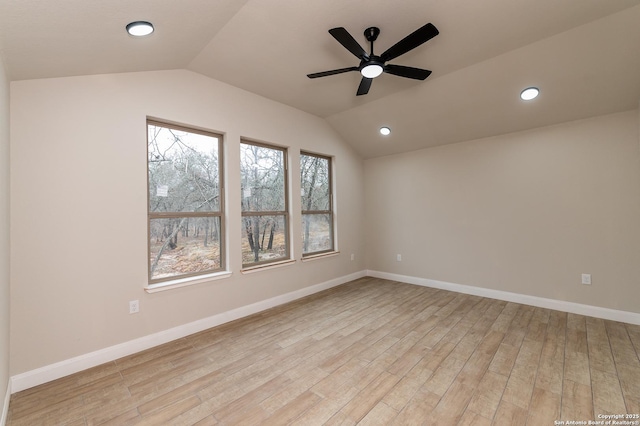 unfurnished room with light hardwood / wood-style flooring, ceiling fan, and vaulted ceiling