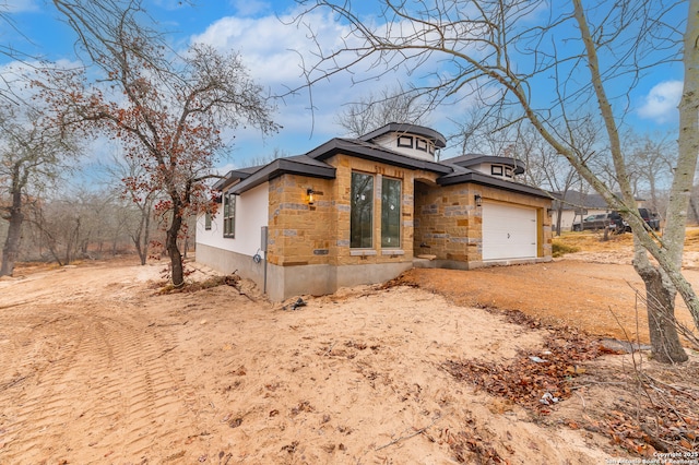 view of property exterior featuring a garage