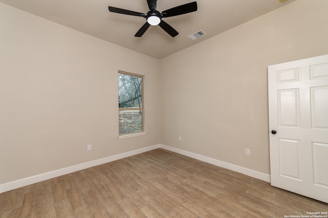 empty room featuring ceiling fan and light wood-type flooring